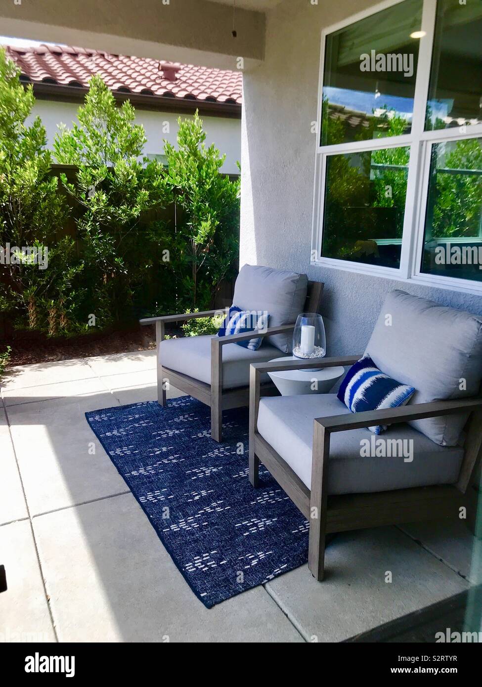 A Beautiful Back Patio Porch And Furniture Sitting Chairs With