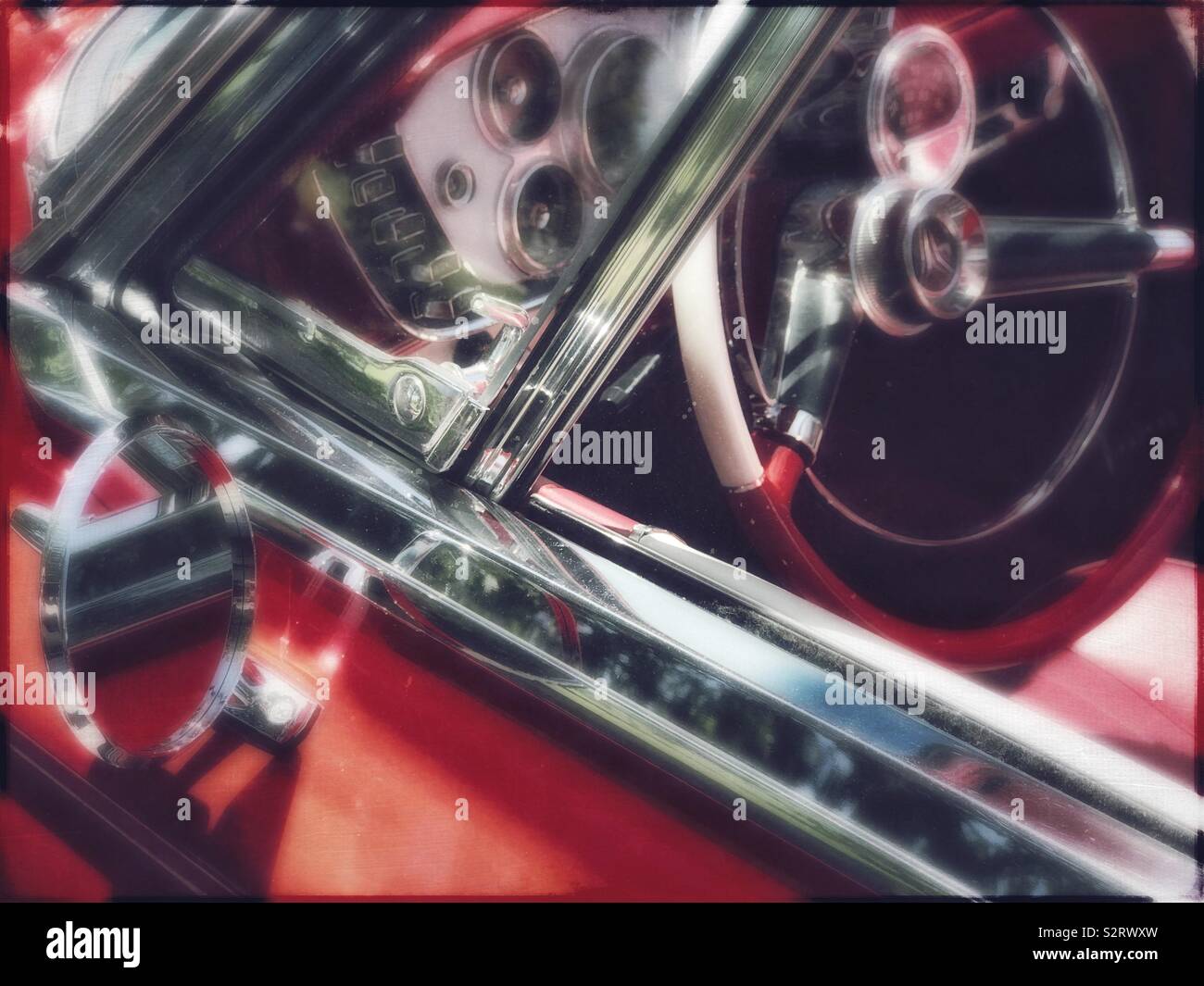 Red classic car drivers side window and steering wheel - Smartphone Captured Stock Image