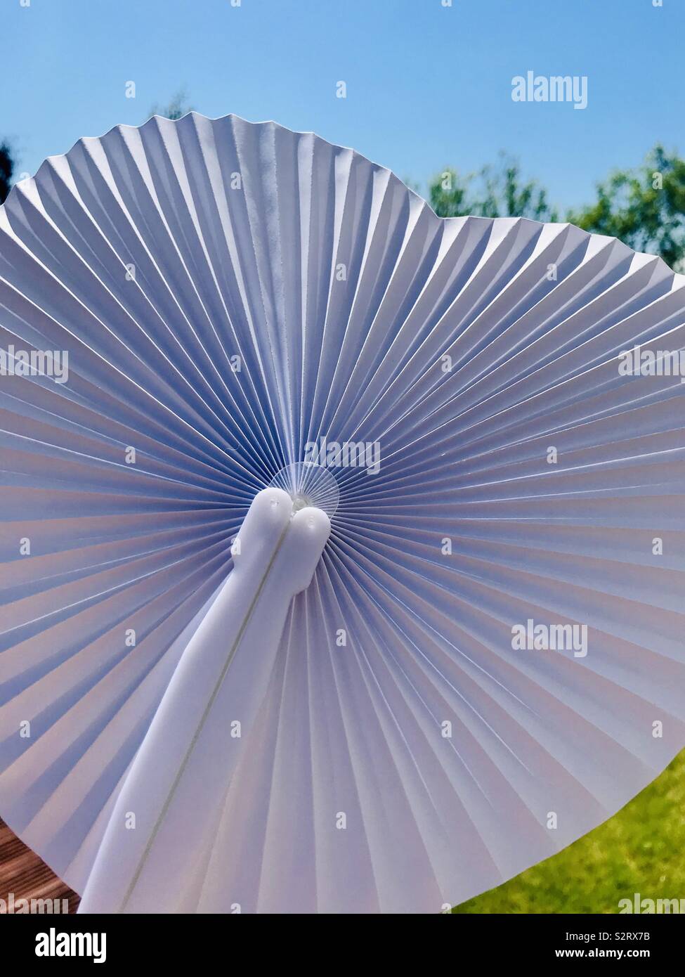 Paper fan on a hot summers day Stock Photo Alamy