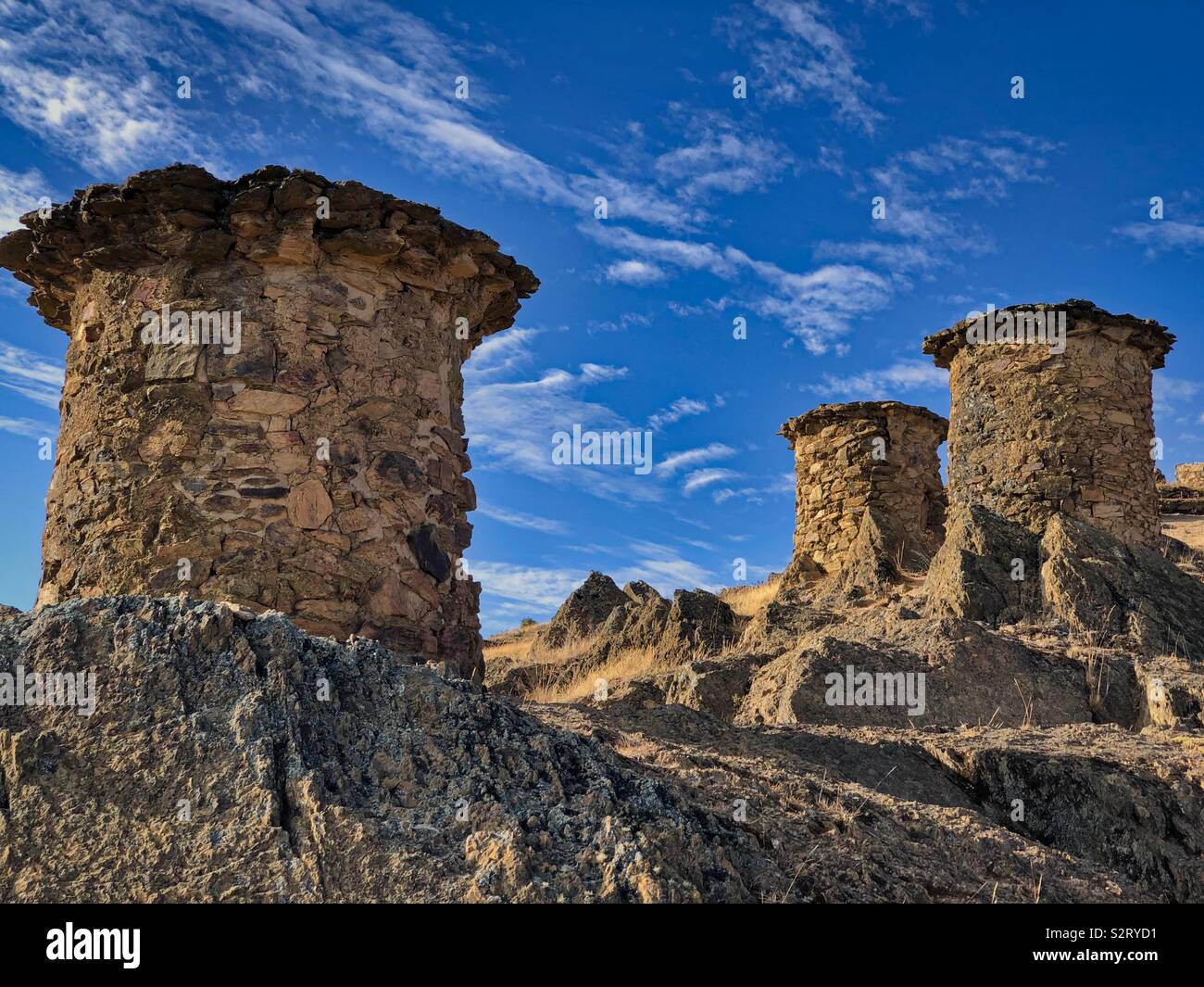 Three 3 Pre-Inca civilisation civilization tombs or chullpas at Ninamarka or Ninamarca, Cusco Cuzco Region, Paucartambo Province, Colquepata District, Perú Peru South America. - Smartphone Captured Stock Image