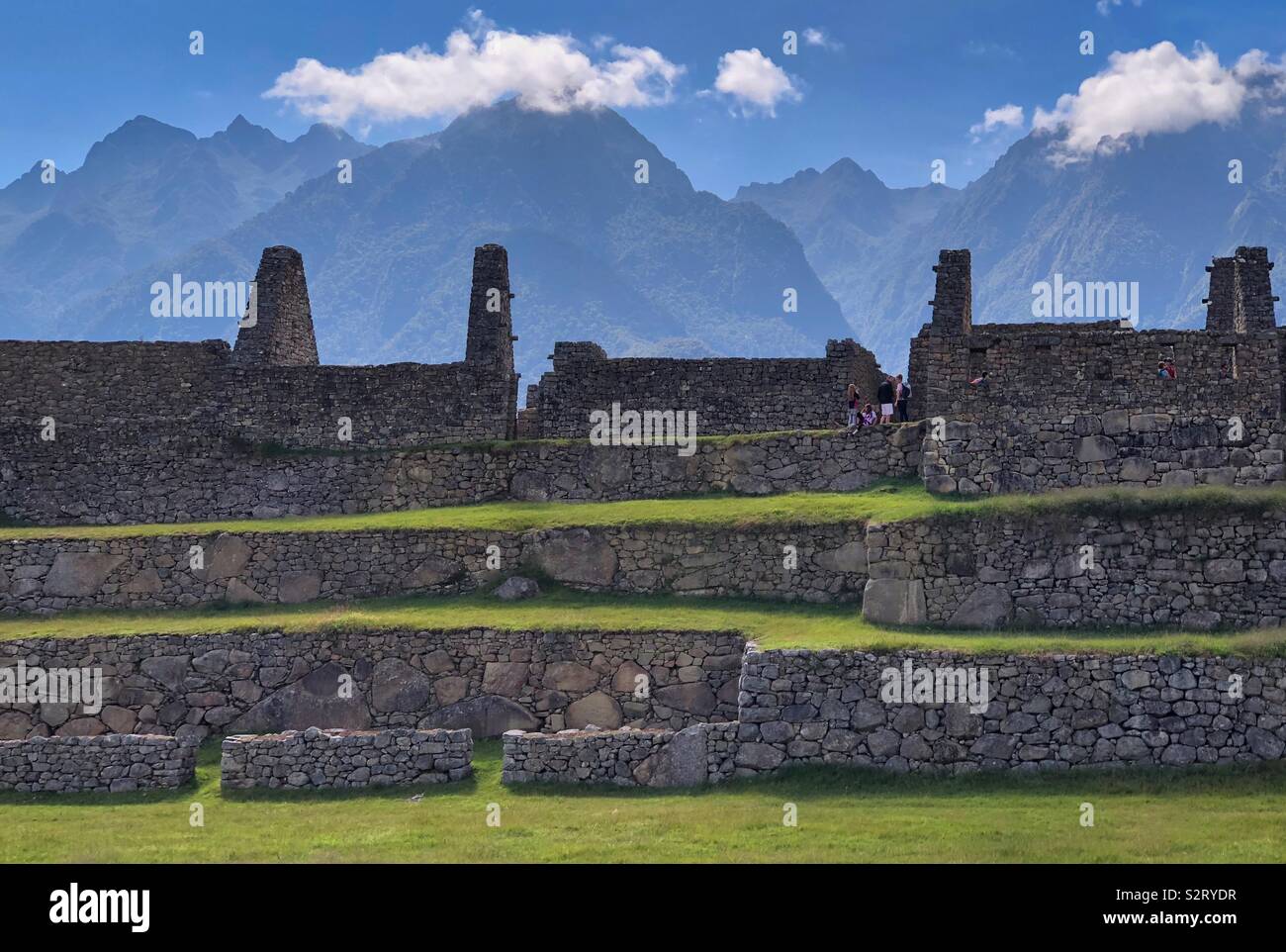 Tiered ruined buildings ruins at Machupicchu Machu Picchu Incan historical site, Peru Perú with the Andes in the background. - Smartphone Captured Stock Image
