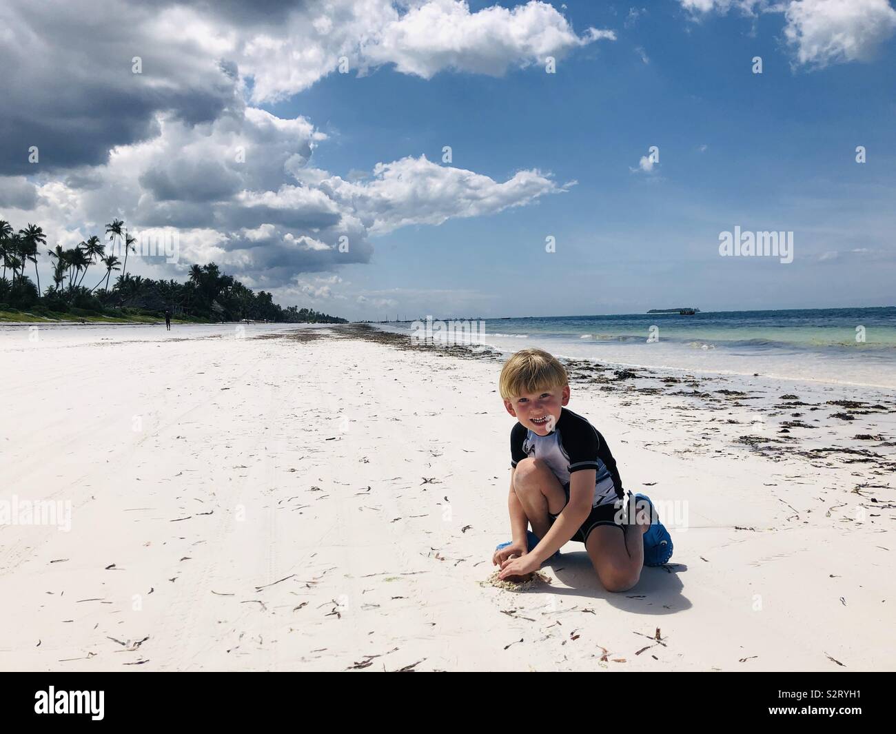 Little boy on the exotic beach Stock Photo