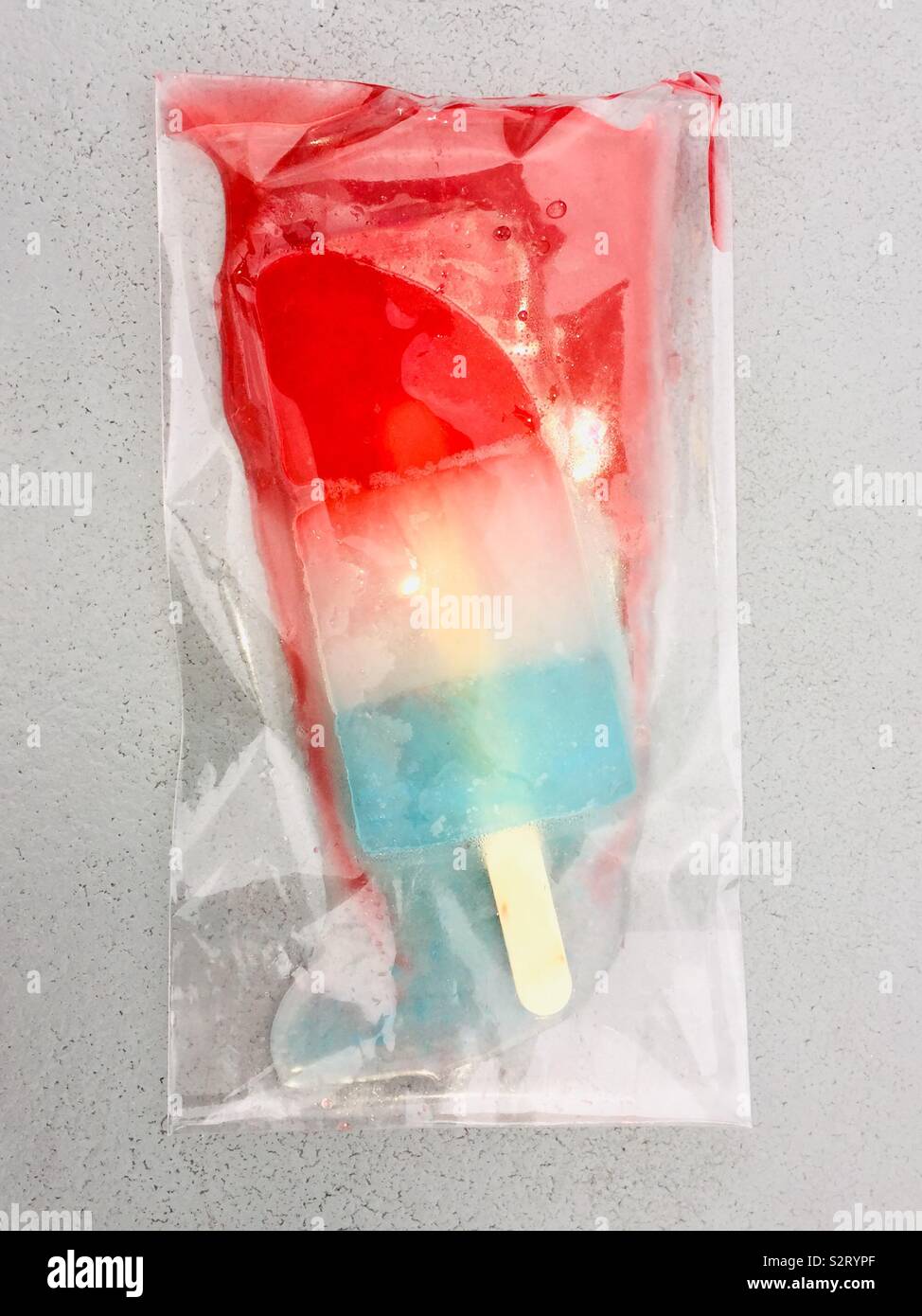 Melting gormet popsicle in plastic - Smartphone Captured Stock Image