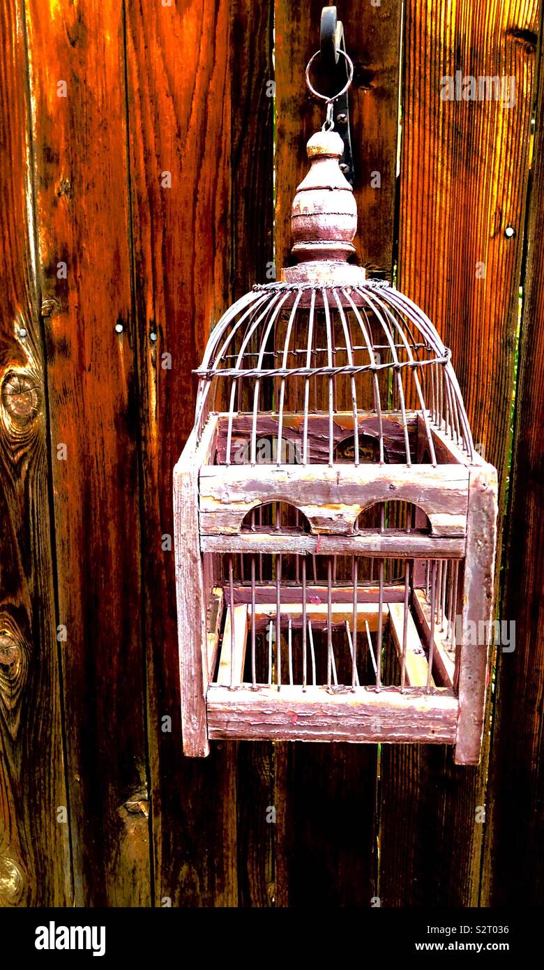 Faded birdcage decoration Stock Photo