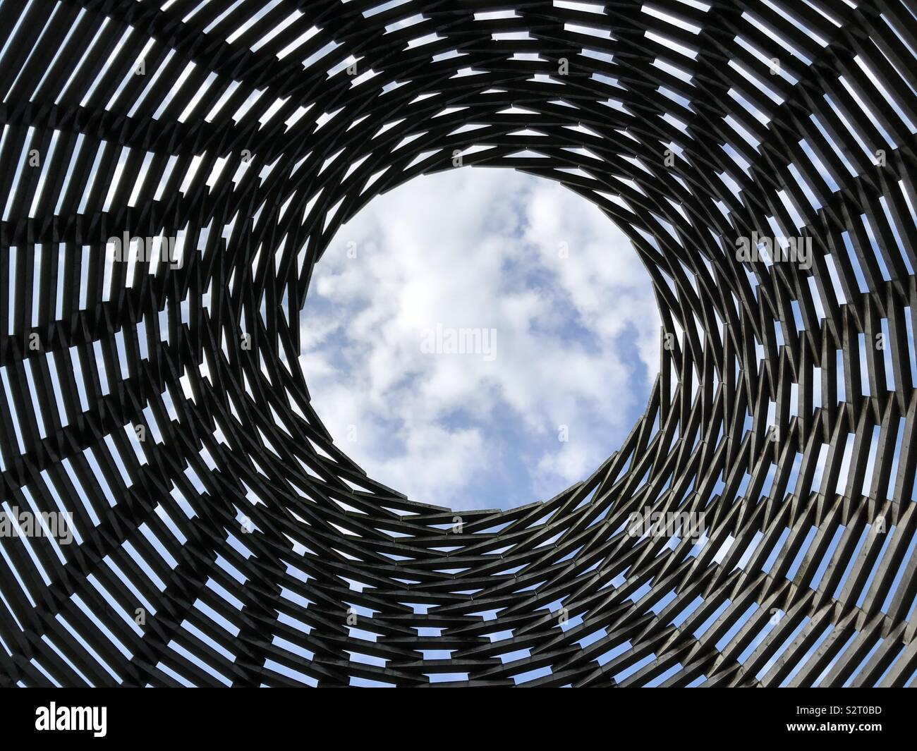 Opening in a wooden structure towards the sky Stock Photo