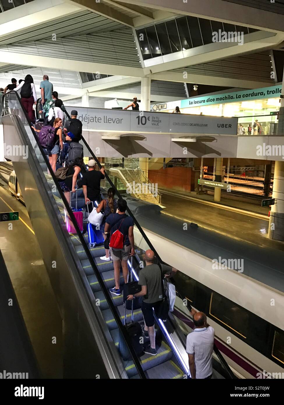Passengers going up a escalator. Puerta de Atocha railway station, Madrid, Spain. - Smartphone Captured Stock Image