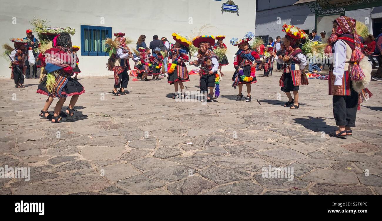 Peruvian children in colourful costumes rehearsing their dance for Inti Raymi’rata Inti Raymi sun festival in Cusco Cuzco Perú Peru. - Smartphone Captured Stock Image