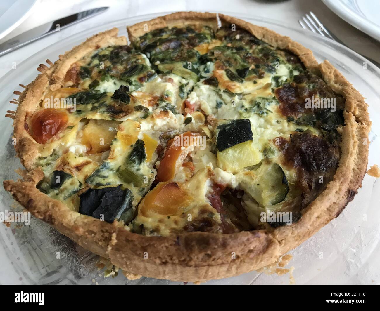 Mediterranean vegetable quiche on a plate. - Smartphone Captured Stock Image