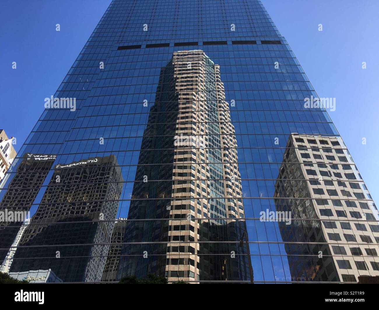 LOS ANGELES, CA, JUN 2019: reflections of neighboring buildings in the windows of the Wilshire Grand skyscraper, Financial District Downtown Stock Photo