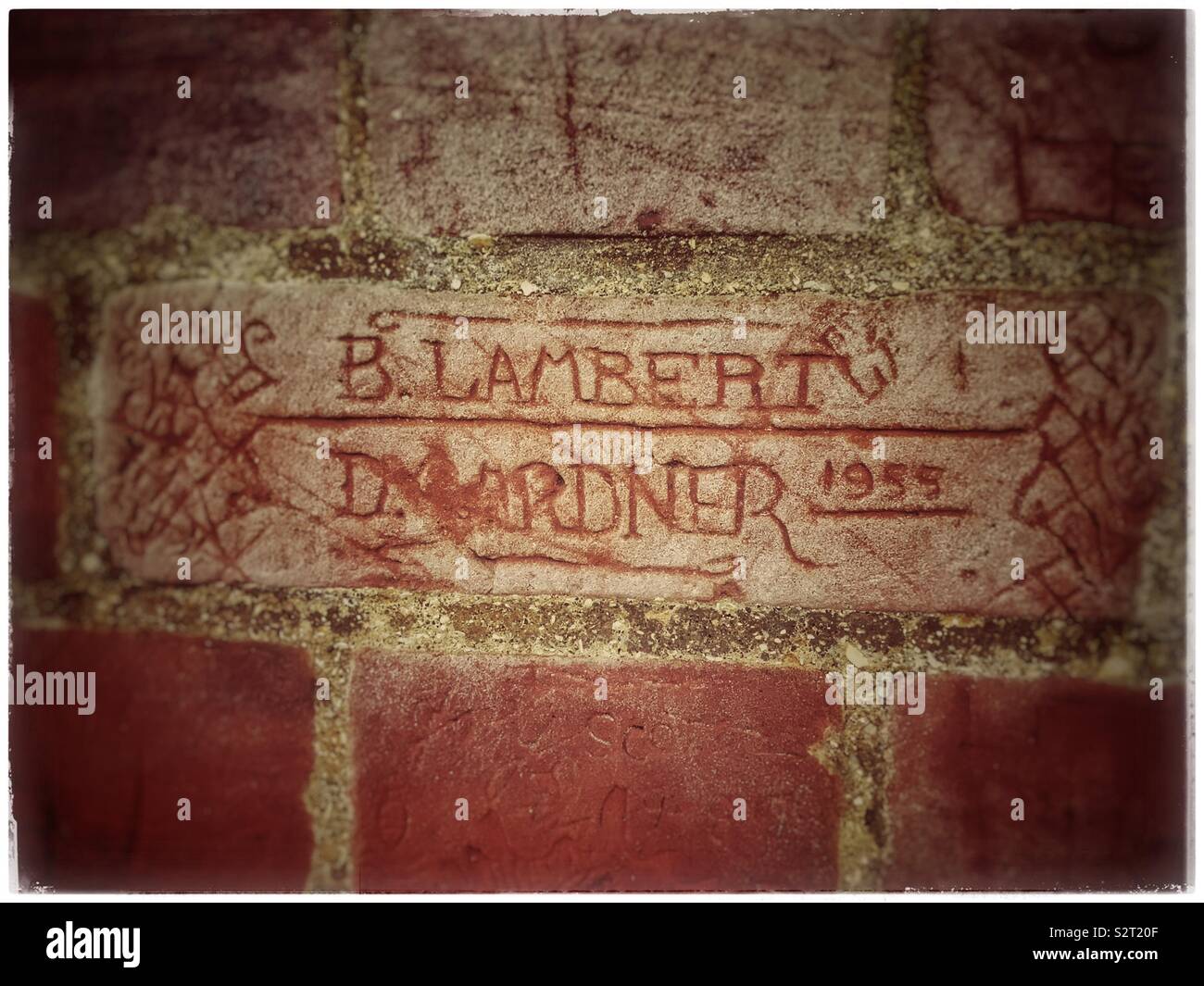 1955 graffiti on a brick wall in Felixstowe, Suffolk - Smartphone Captured Stock Image
