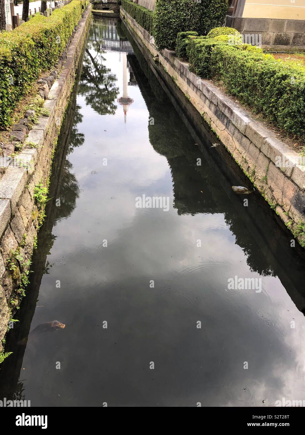 Reflection of the Kyoto Tower view from along the Higashi Hongan-Ji temple . - Smartphone Captured Stock Image