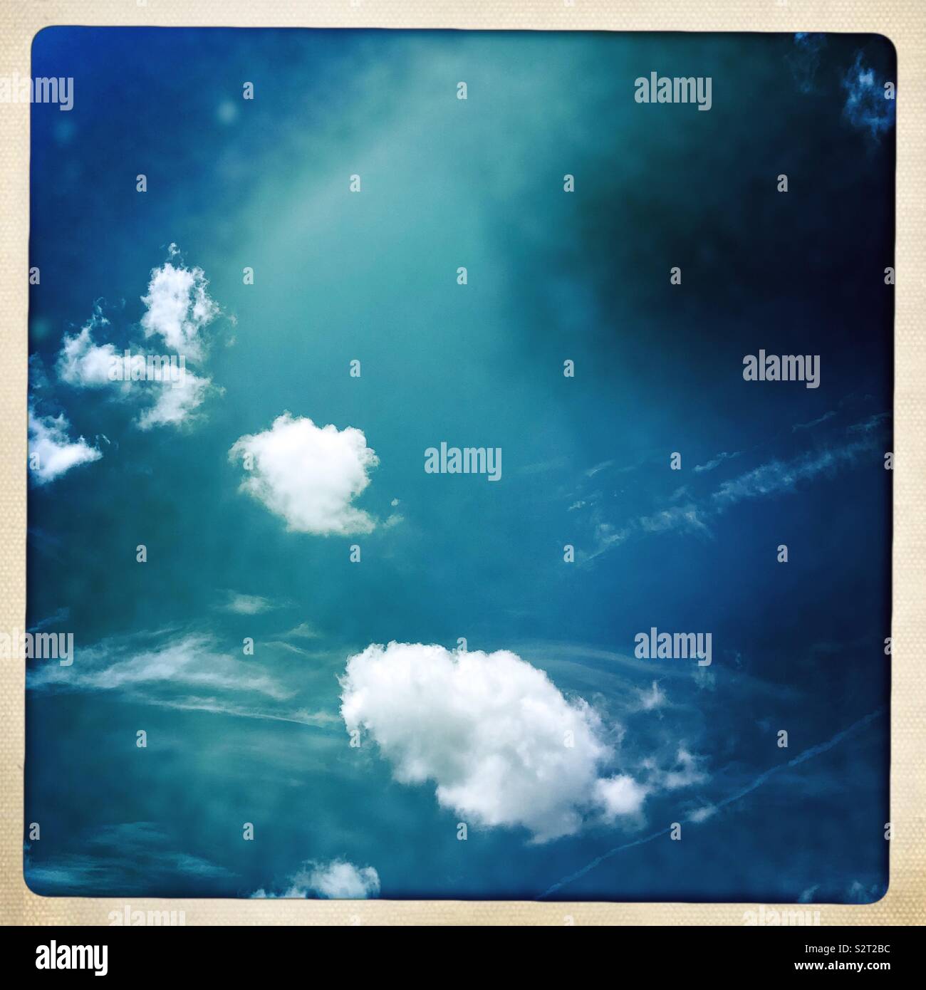 Bright white clouds against brilliant blue sky - Smartphone Captured Stock Image