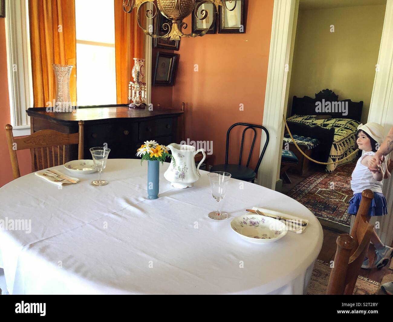 Late 1800s dining room in historic cobblestone house during tour Stock Photo