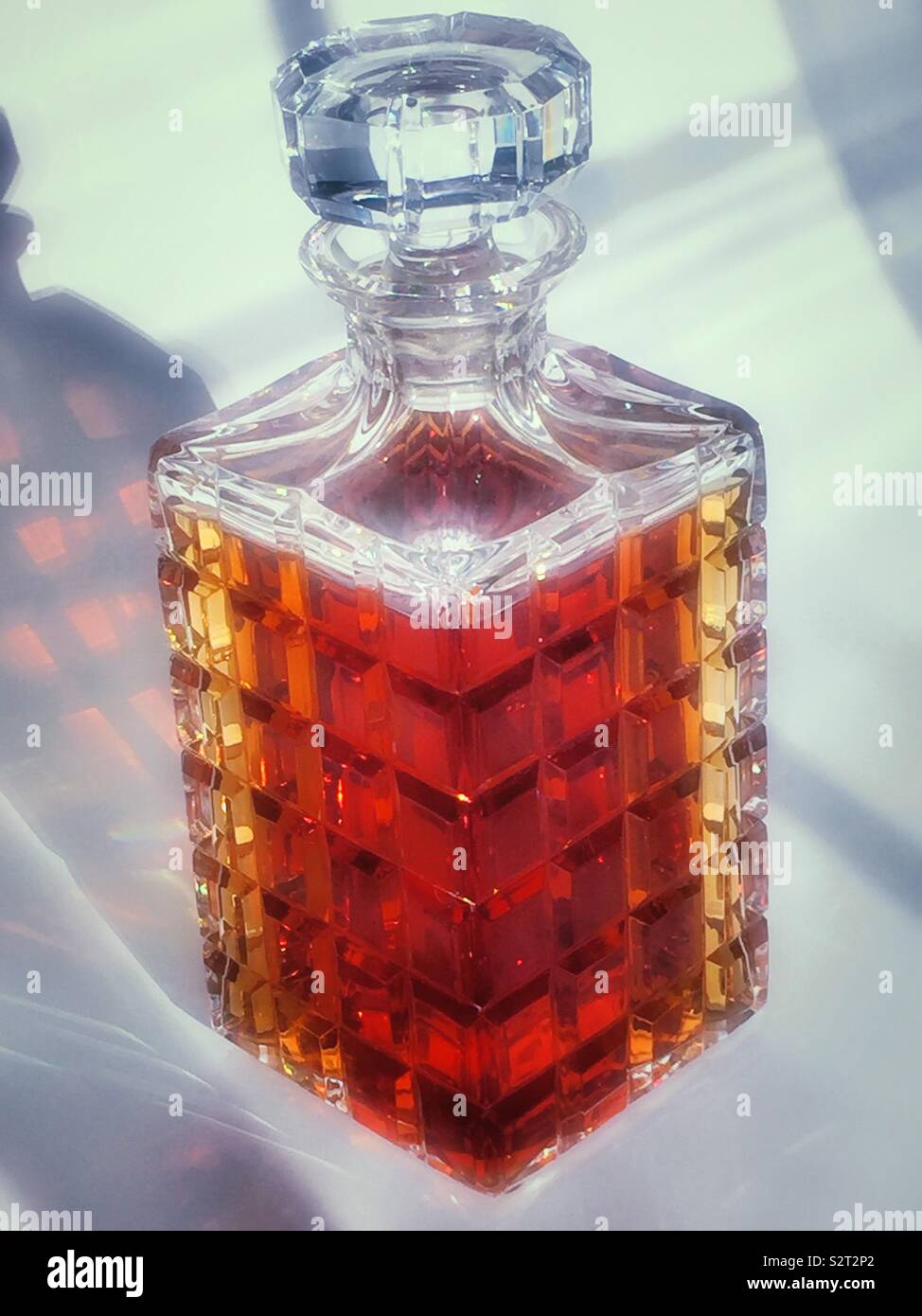 Crystal glass decanter filled with premium whiskey, USA - Smartphone Captured Stock Image