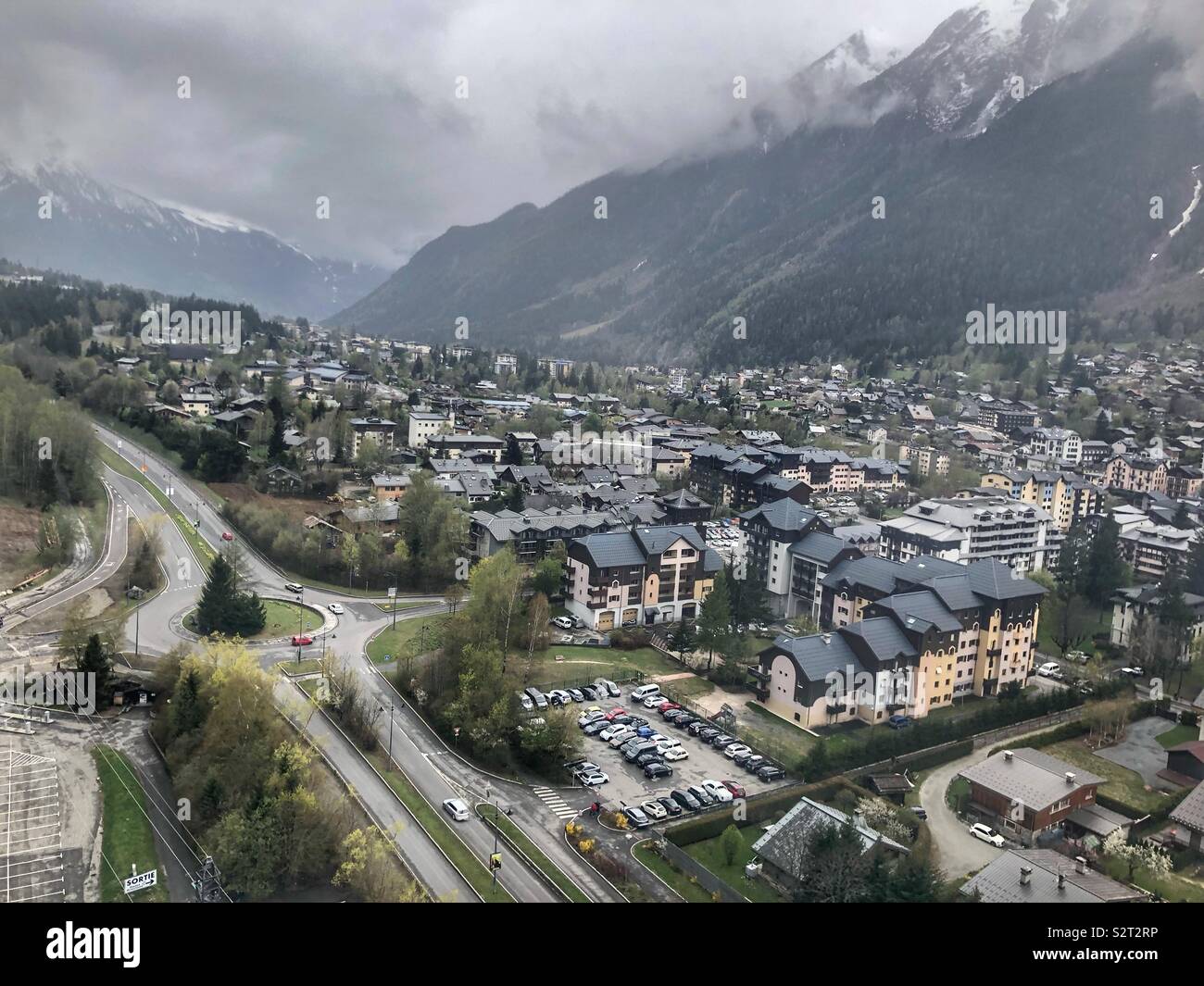 Aerial view of Chamonix from Ascending Cable car to mountains in Spring - Smartphone Captured Stock Image Aerial view of Chamonix from Ascending Cable car to mountains in Spring - Smartphone Captured Stock Image