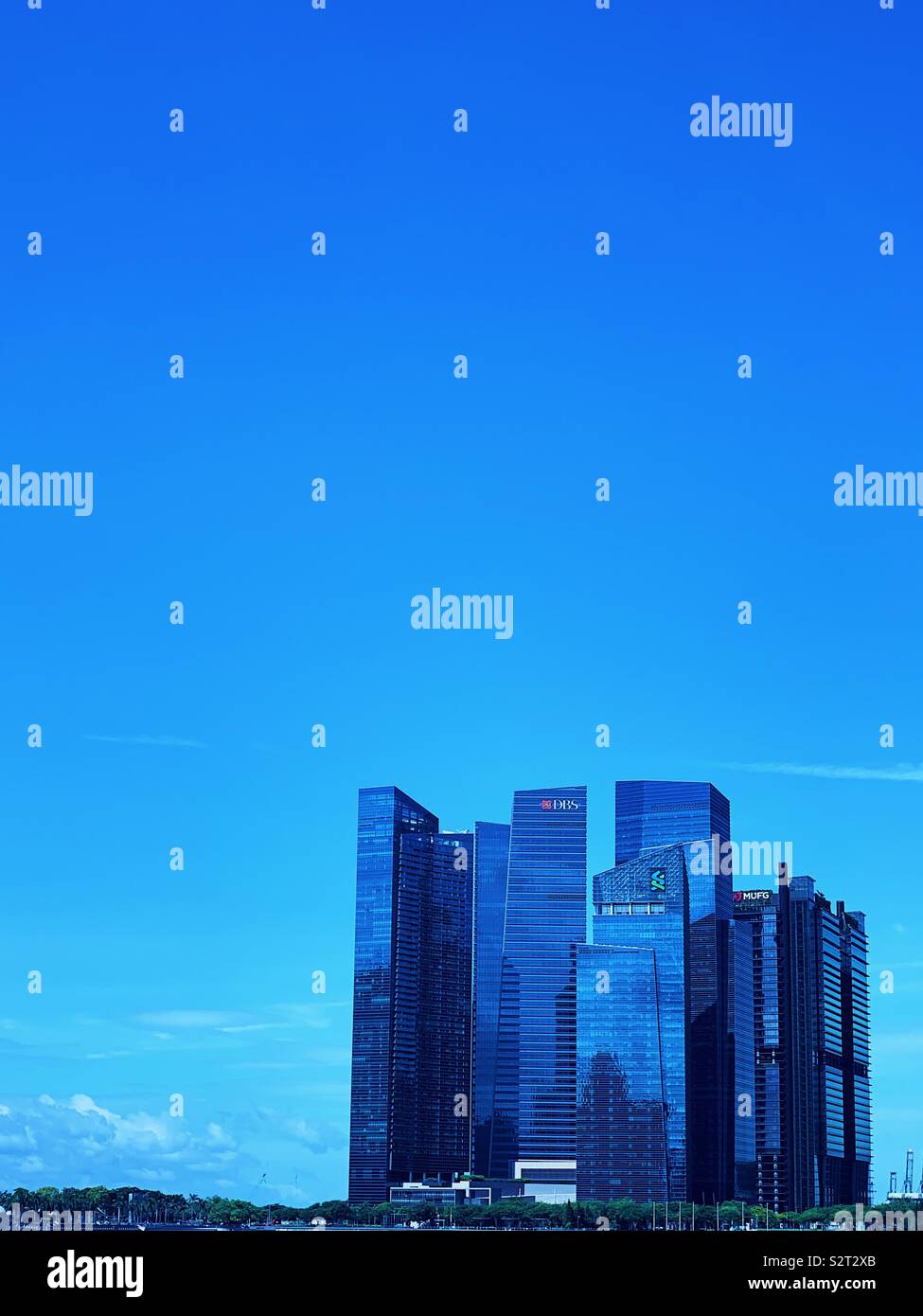 Marina bay office towers in Singapore on a blue sky summer day. - Smartphone Captured Stock Image