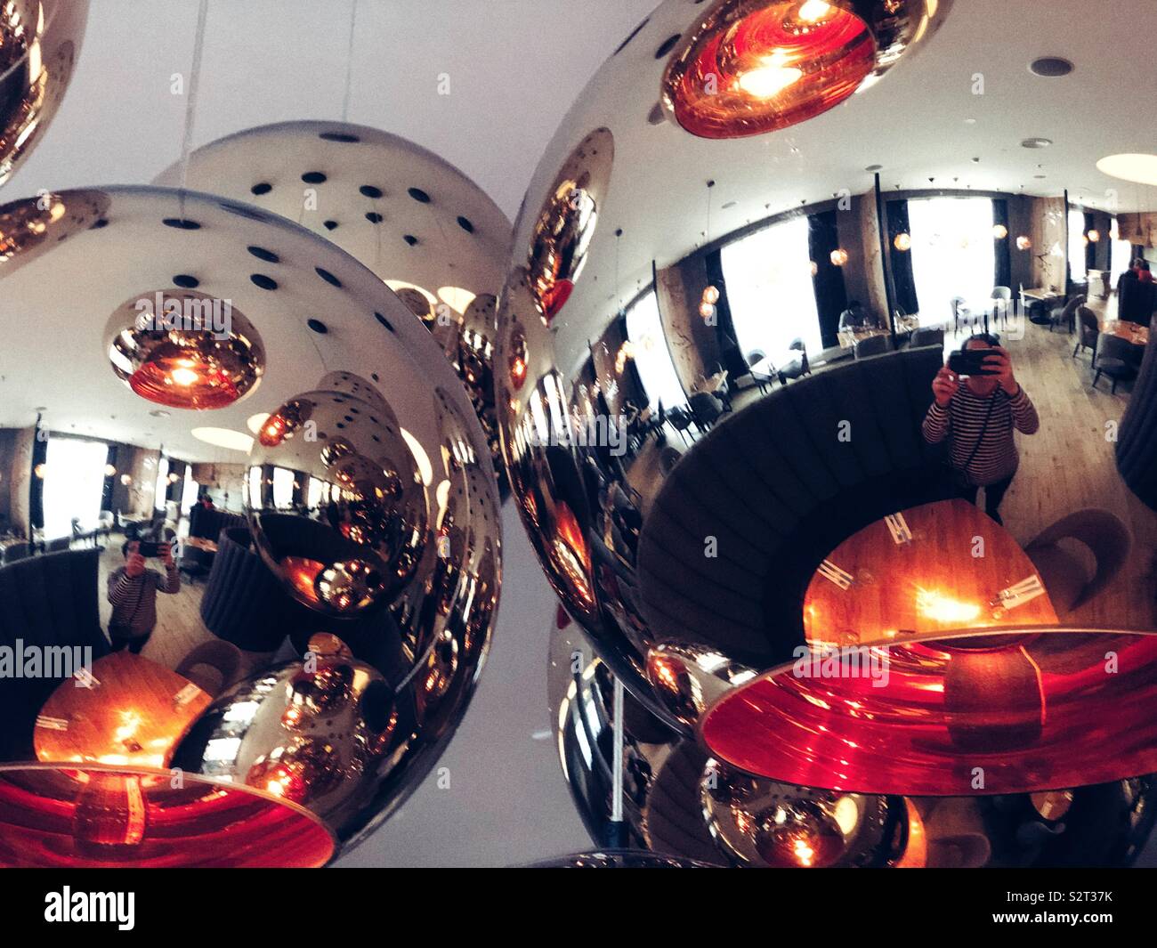 Modern light fixtures hanging from the ceiling in hotel in Reykjavik Stock Photo