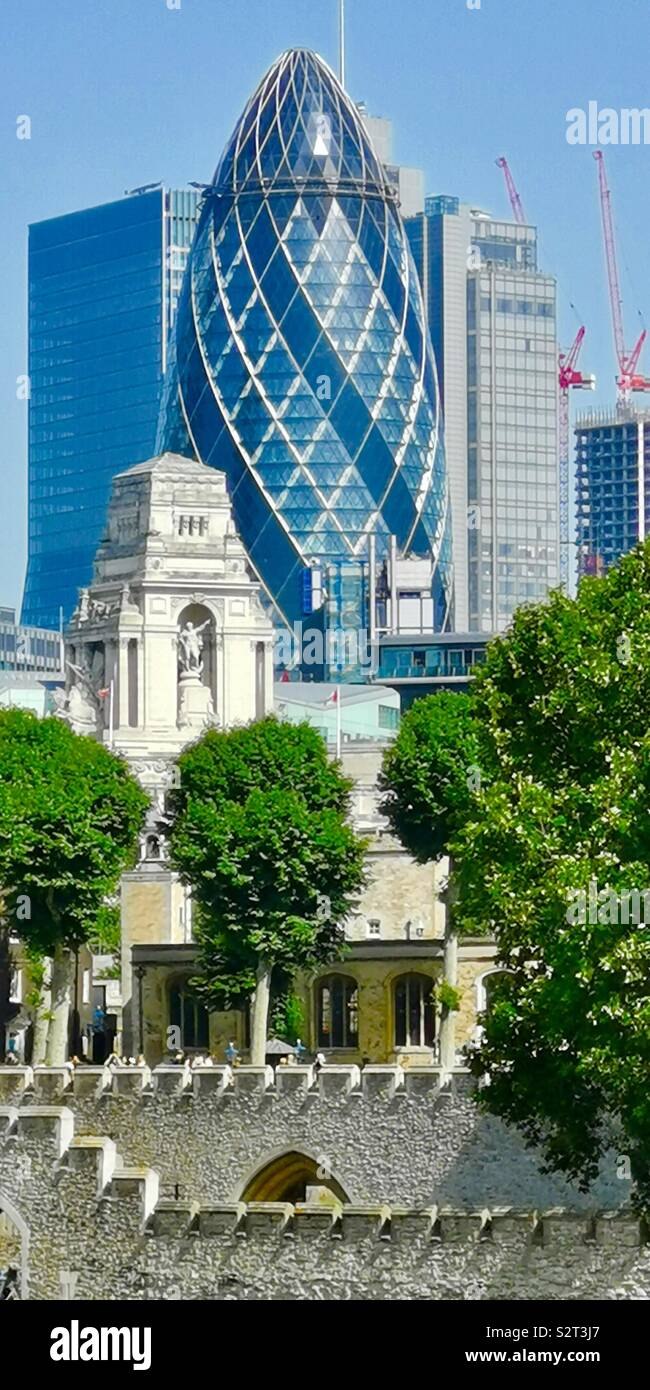 Old and new. The modern Gherkin building and the Tower of London. - Smartphone Captured Stock Image
