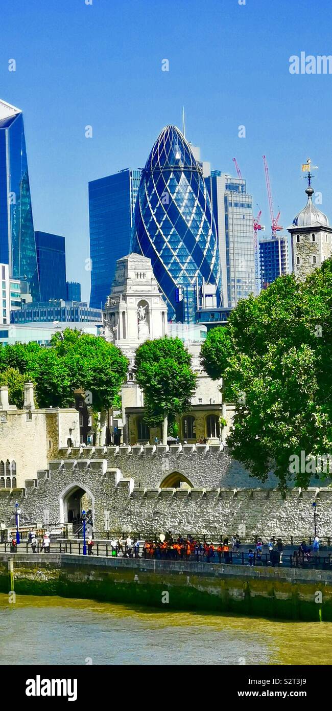 Old and new. The modern Gherkin building and the Tower of London. - Smartphone Captured Stock Image