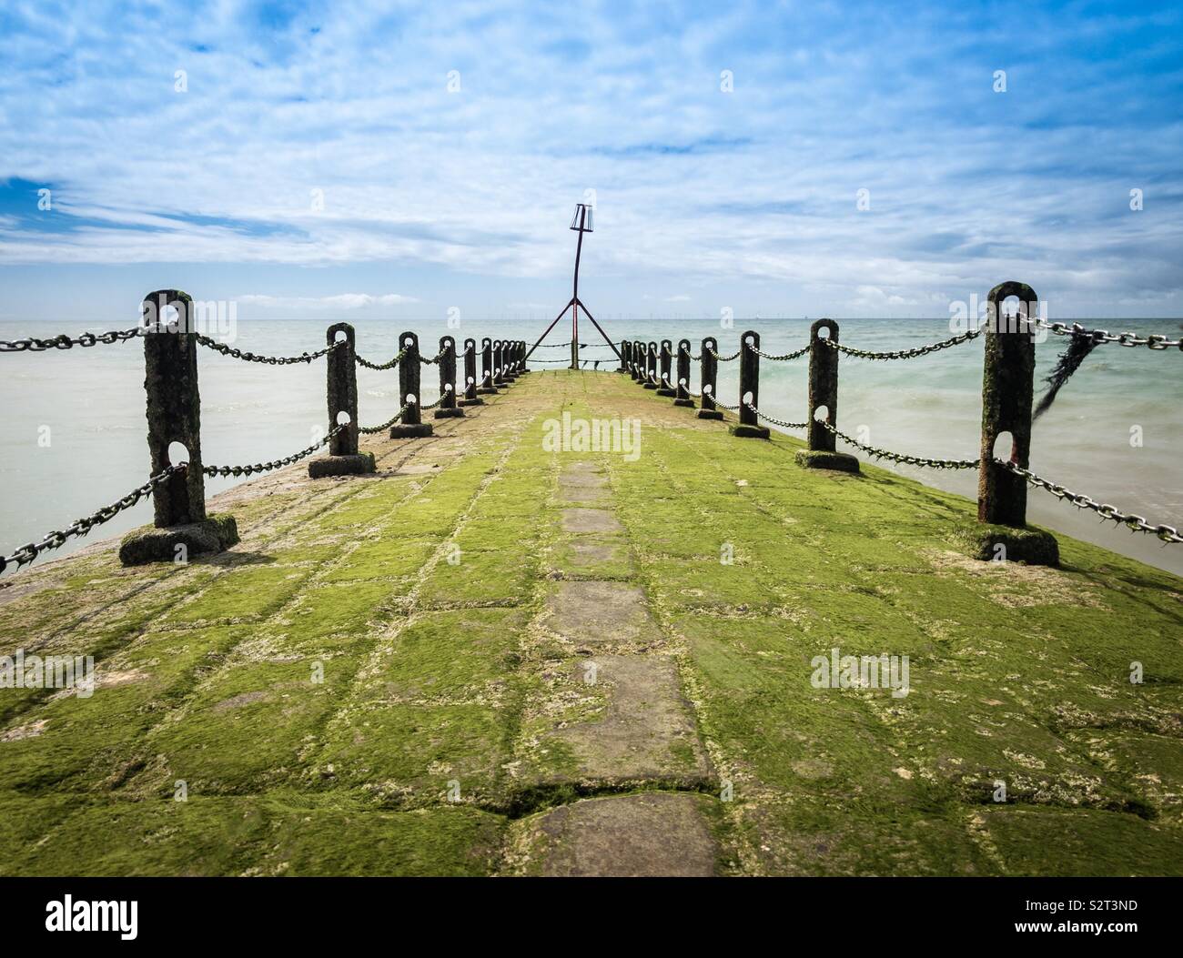 Seaweed covered jetty at Hove, East Sussex, England, U.K. stretching out to sea. - Smartphone Captured Stock Image