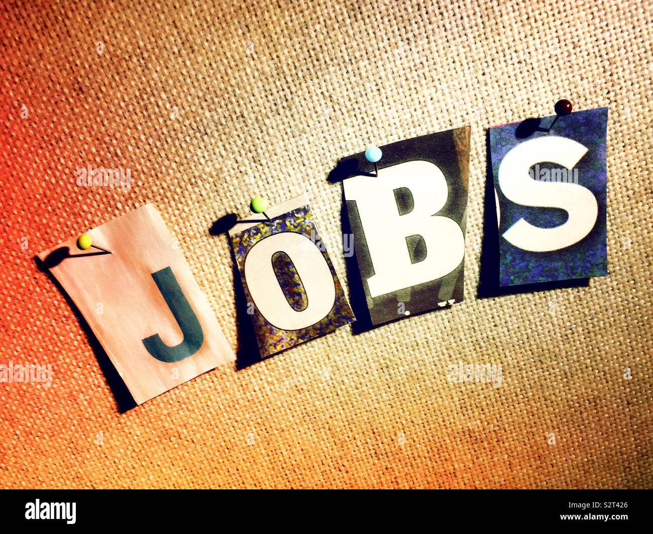 The word jobs on a bulletin board in the ransom note style  typography, USA Stock Photo