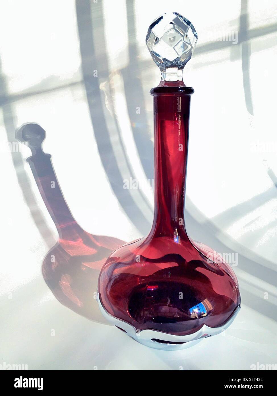 Elegant long necked decanter on a white background - Smartphone Captured Stock Image