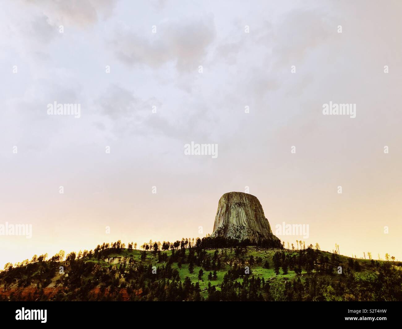Devils Tower at sunset after a spring shower Stock Photo