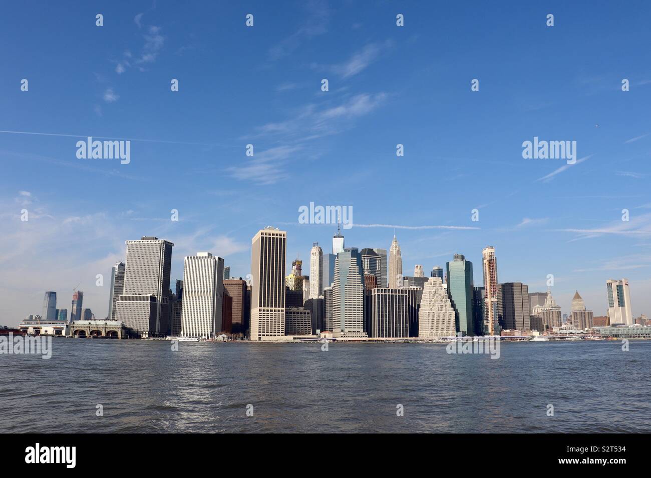 Downtown New York skyline viewed across river Hudson Stock Photo