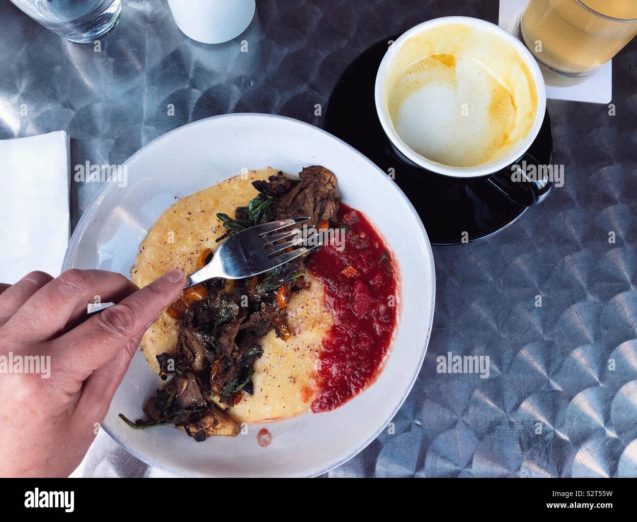 Vegan polenta and mushrooms at fancy brunch place in gentrified area of Seattle Stock Photo