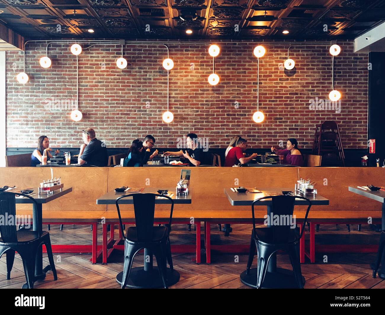 People are dining in a new hot pot restaurant near Seattle Stock Photo Alamy