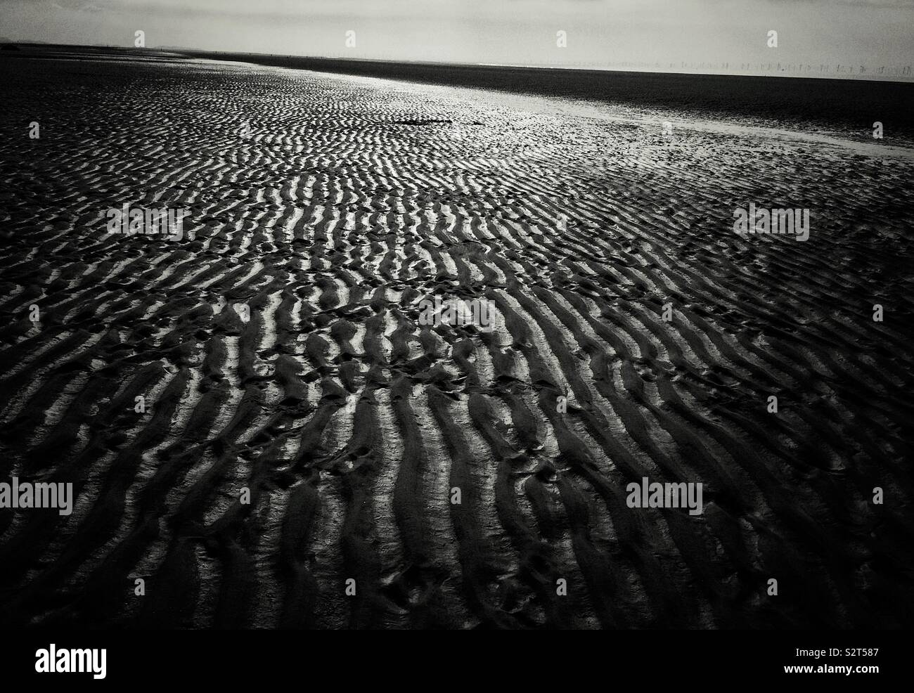 Black and White of sandy beach in Talacre on the north coast of Wales in the community of Llanasa. United Kingdom - Smartphone Captured Stock Image
