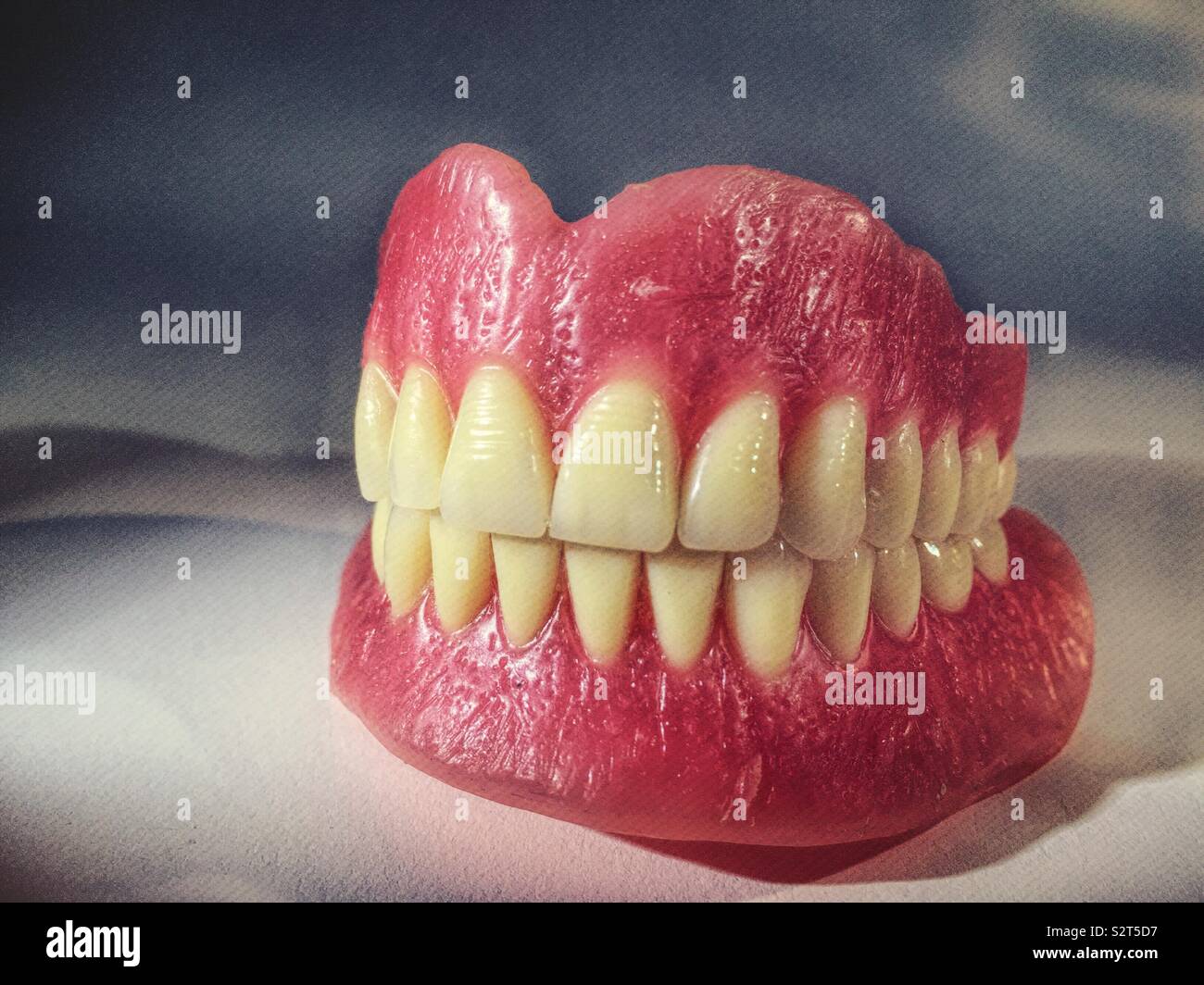 Close up of a brand new full set of dentures on white background - Smartphone Captured Stock Image