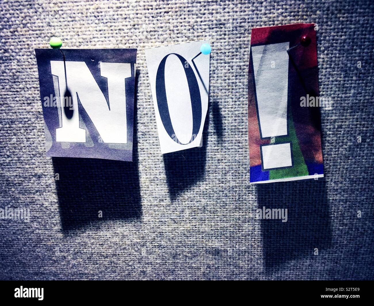 No with an exclamation point Spelled out in Ransom style lettering on A BulletinBoard, USA - Smartphone Captured Stock Image