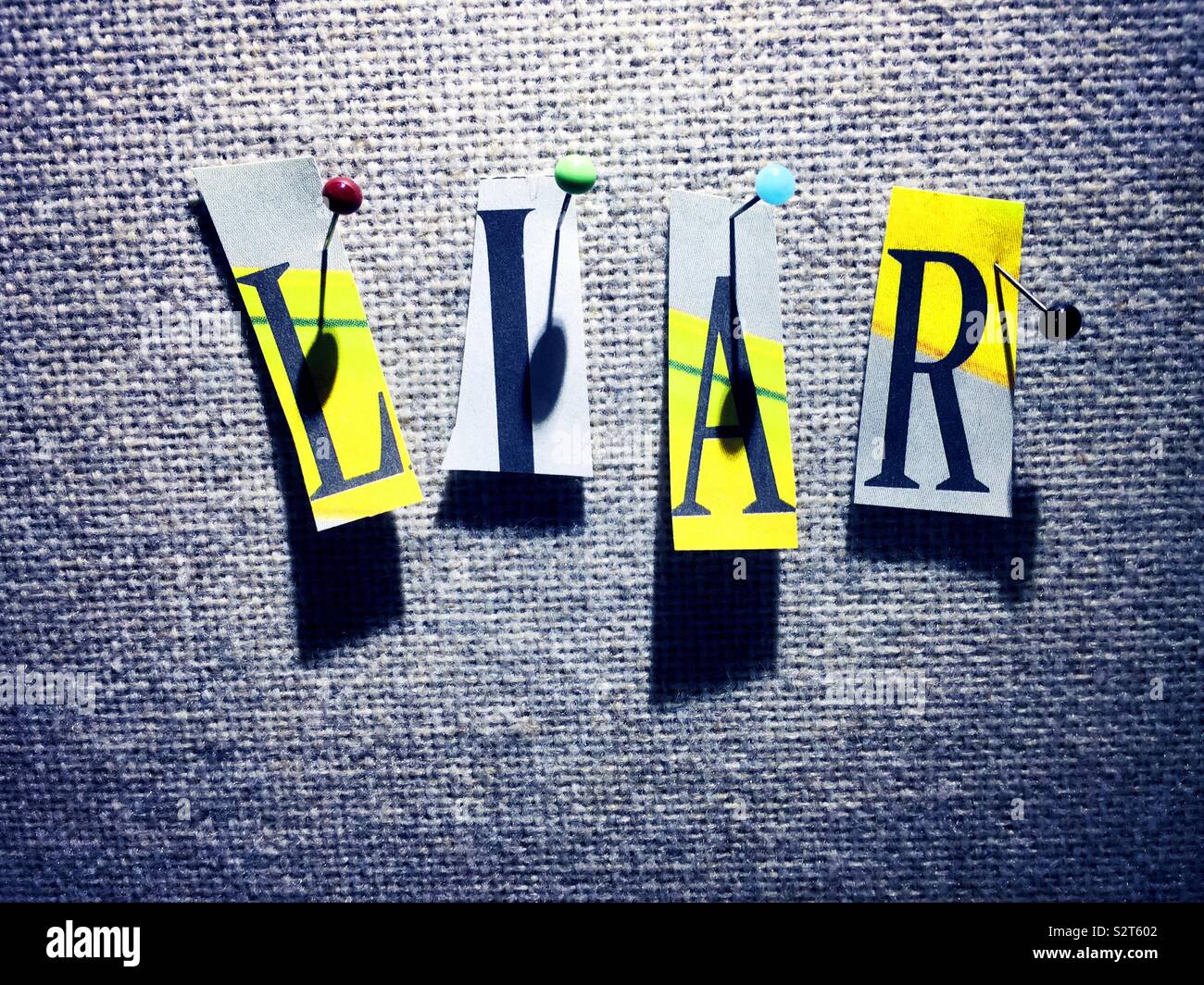 The word liar spelled out on a bulletin board in ransom note style, USA Stock Photo