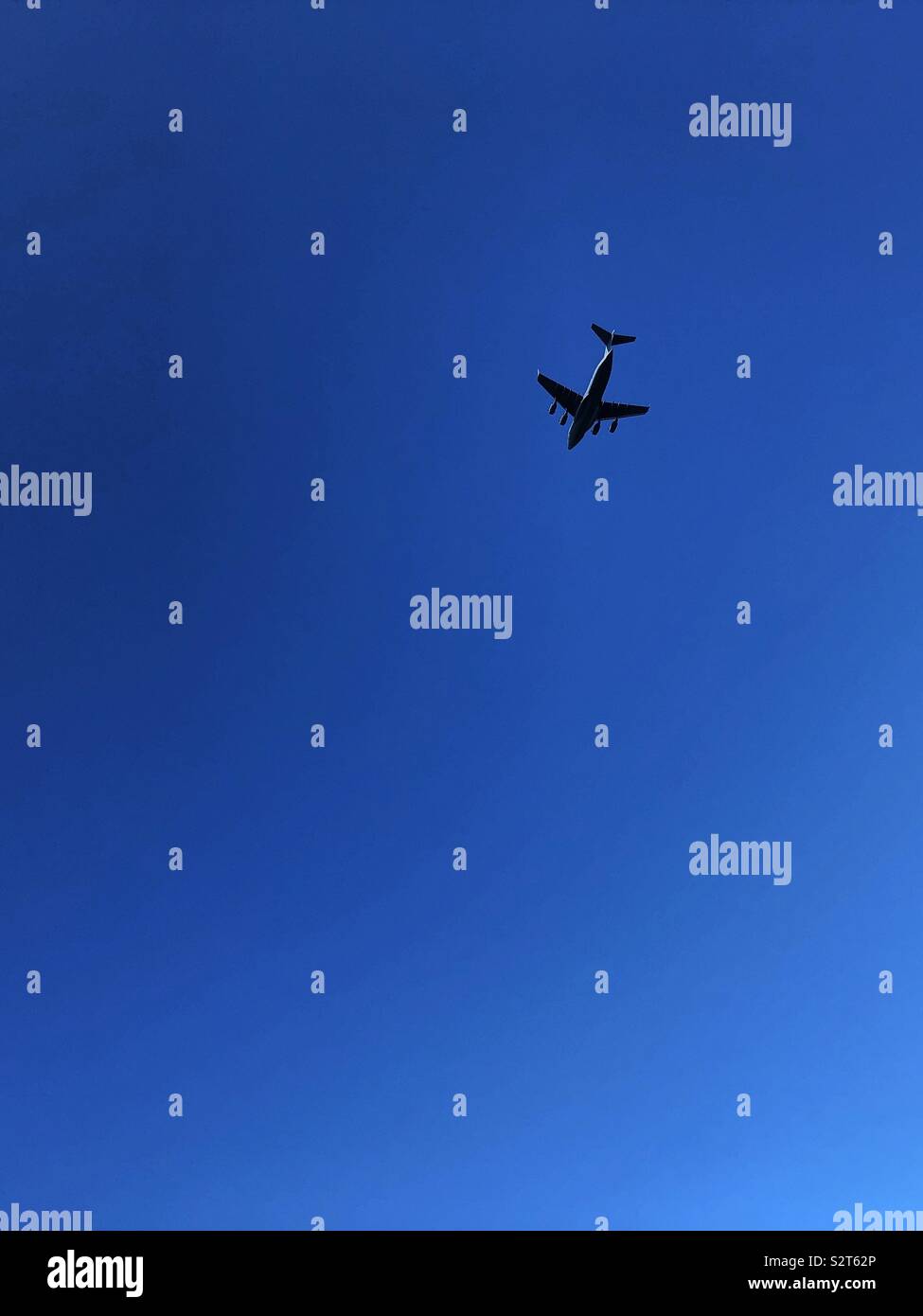 RAF Boeing C-17 Globemaster III in a clear blue sky - Smartphone Captured Stock Image