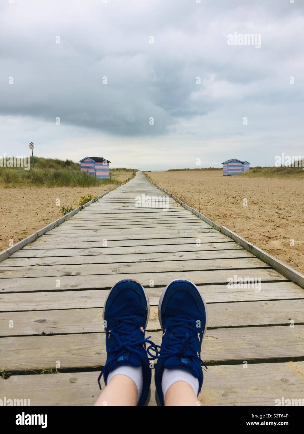Adventure blue shoes on path in Great Yarmouth (Norfolk England) - Smartphone Captured Stock Image