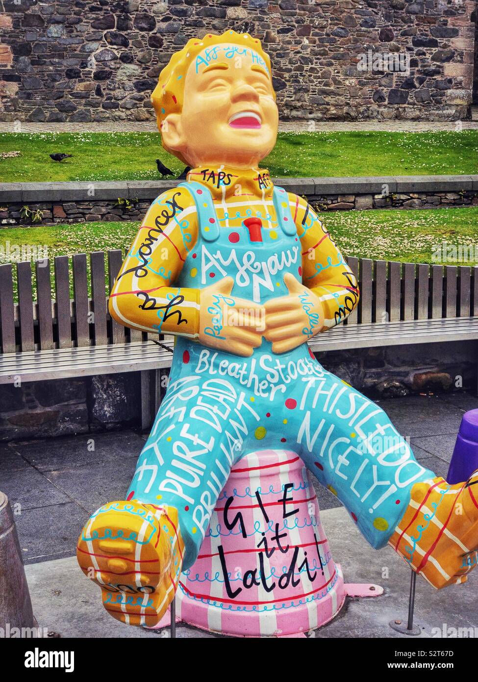 Sculpture of Oor Wullie, a famous Scottish comic book character, in Stranraer, Scotland. Part of the Big Bucket Trail 2019. This one is called Oor Patter and features famous Scottish words and sayings Stock Photo