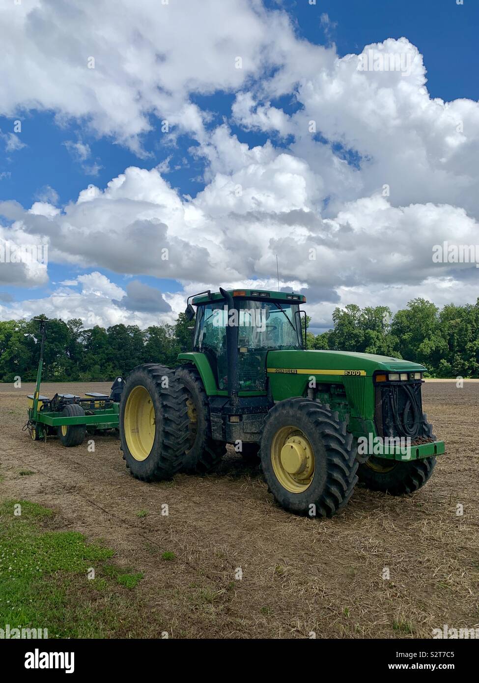 Big John Deere Tractor Pulling Planter on Maryland Farm Stock Photo