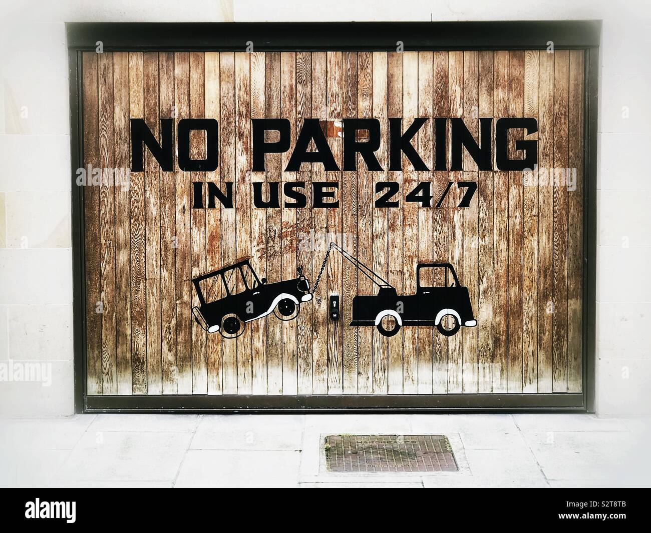 No parking sign on garage door - Smartphone Captured Stock Image