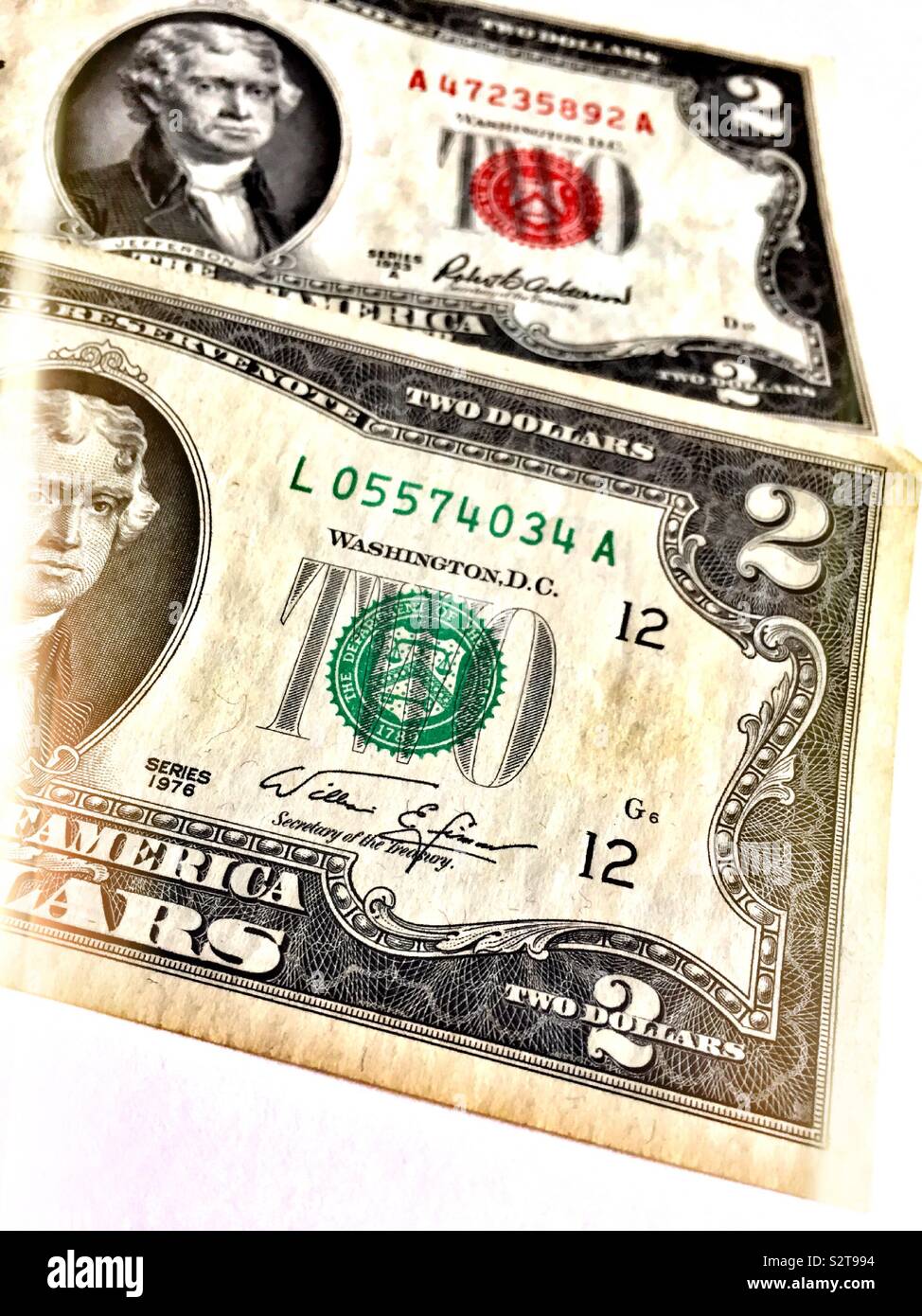 Two dollar bills Close up on white background, USA - Smartphone Captured Stock Image