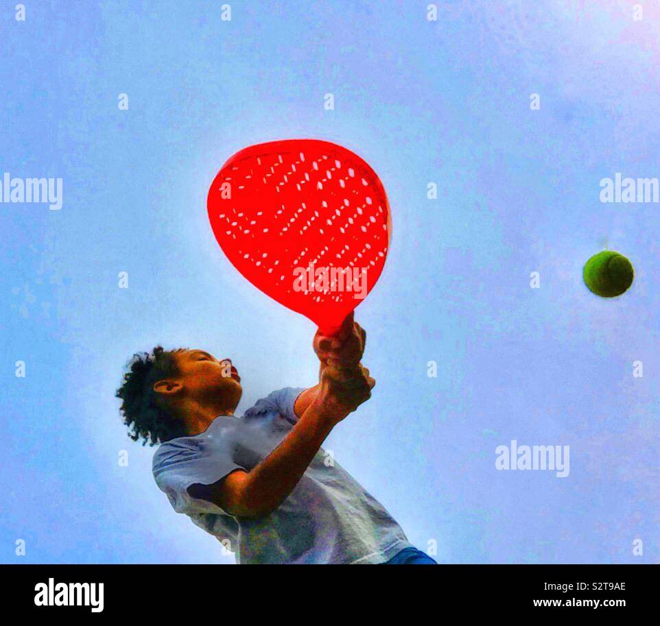 A child playing with a ball. - Smartphone Captured Stock Image