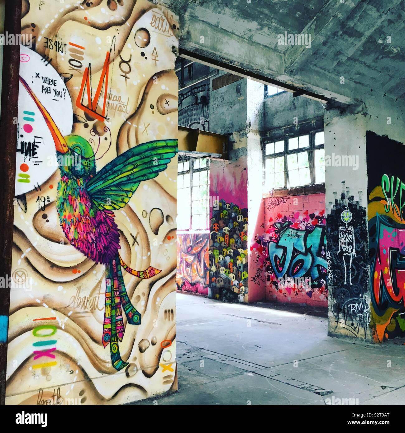 Street art in a derelict warehouse in Uzerche, France Stock Photo