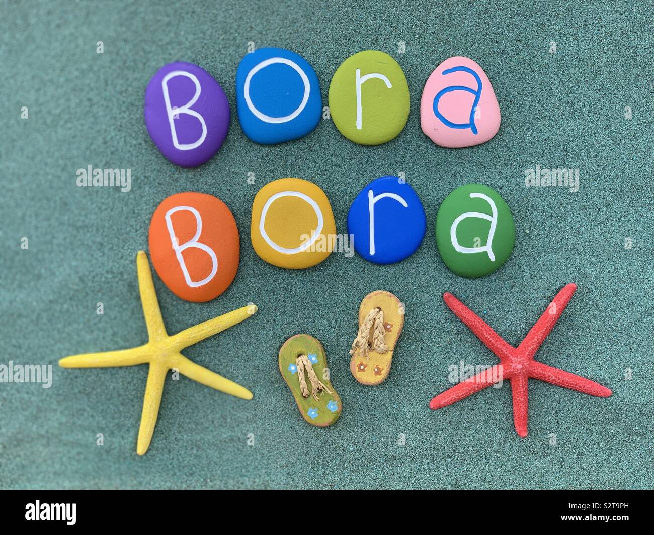 Bora Bora, Island in French Polynesia, souvenir with colored starfishes and stones - Smartphone Captured Stock Image