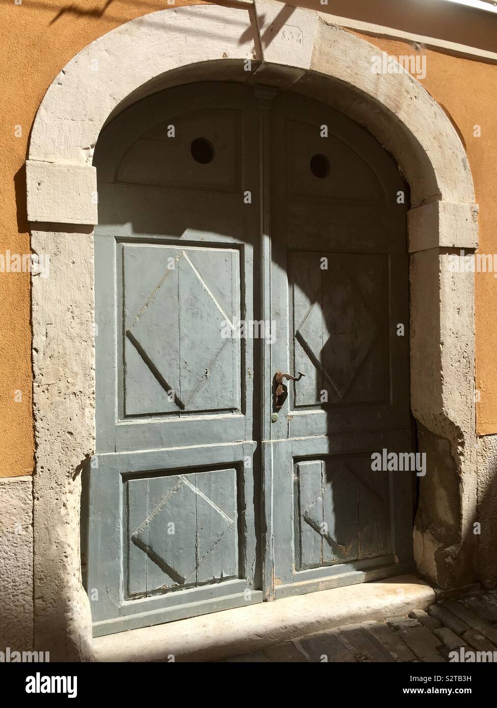 Old Door in Part Shade Stock Photo