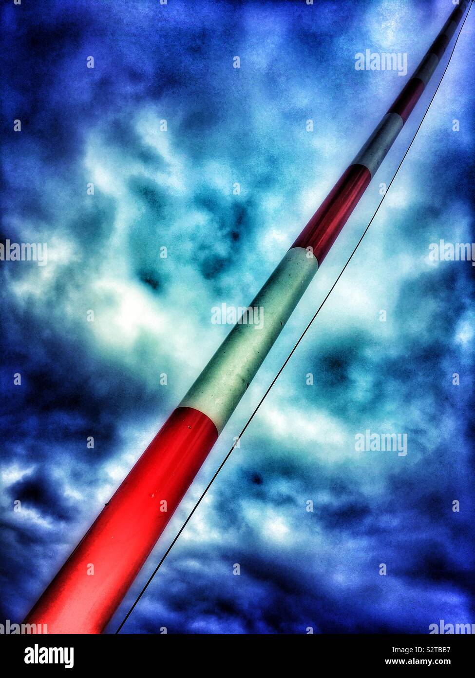 Raised barrier with overcast sky - Smartphone Captured Stock Image