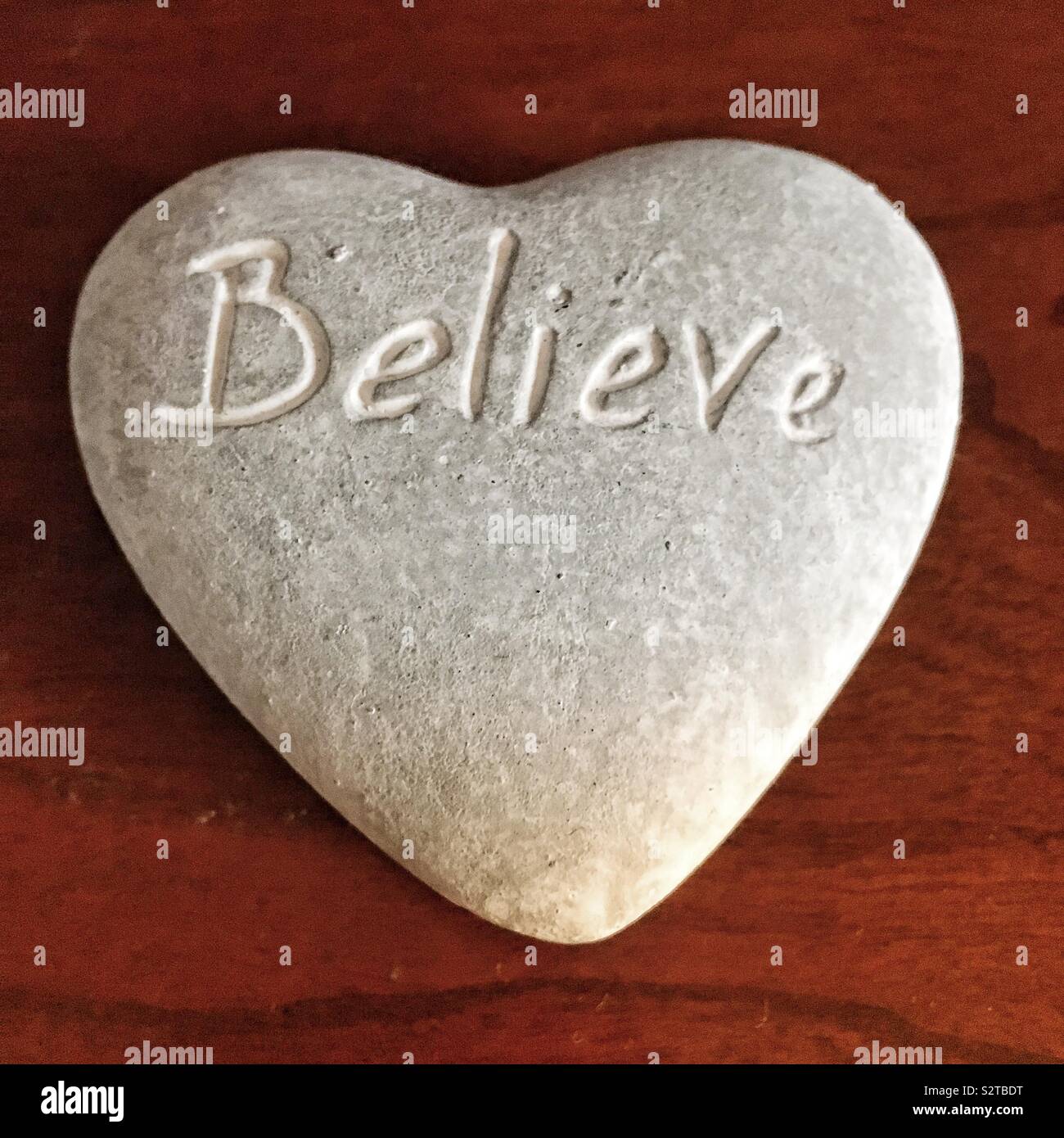 Believe carved in Stone Stock Photo Alamy