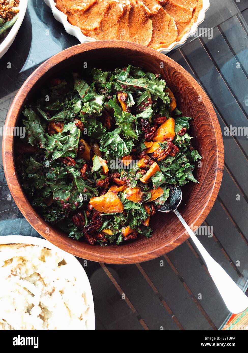 Kale and delicata squash salad for Thanksgiving feast - Smartphone Captured Stock Image