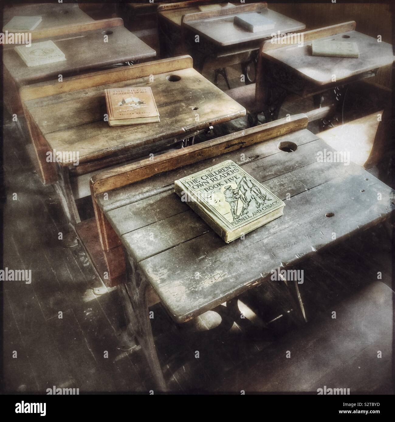 Student desks in an old schoolroom - Smartphone Captured Stock Image