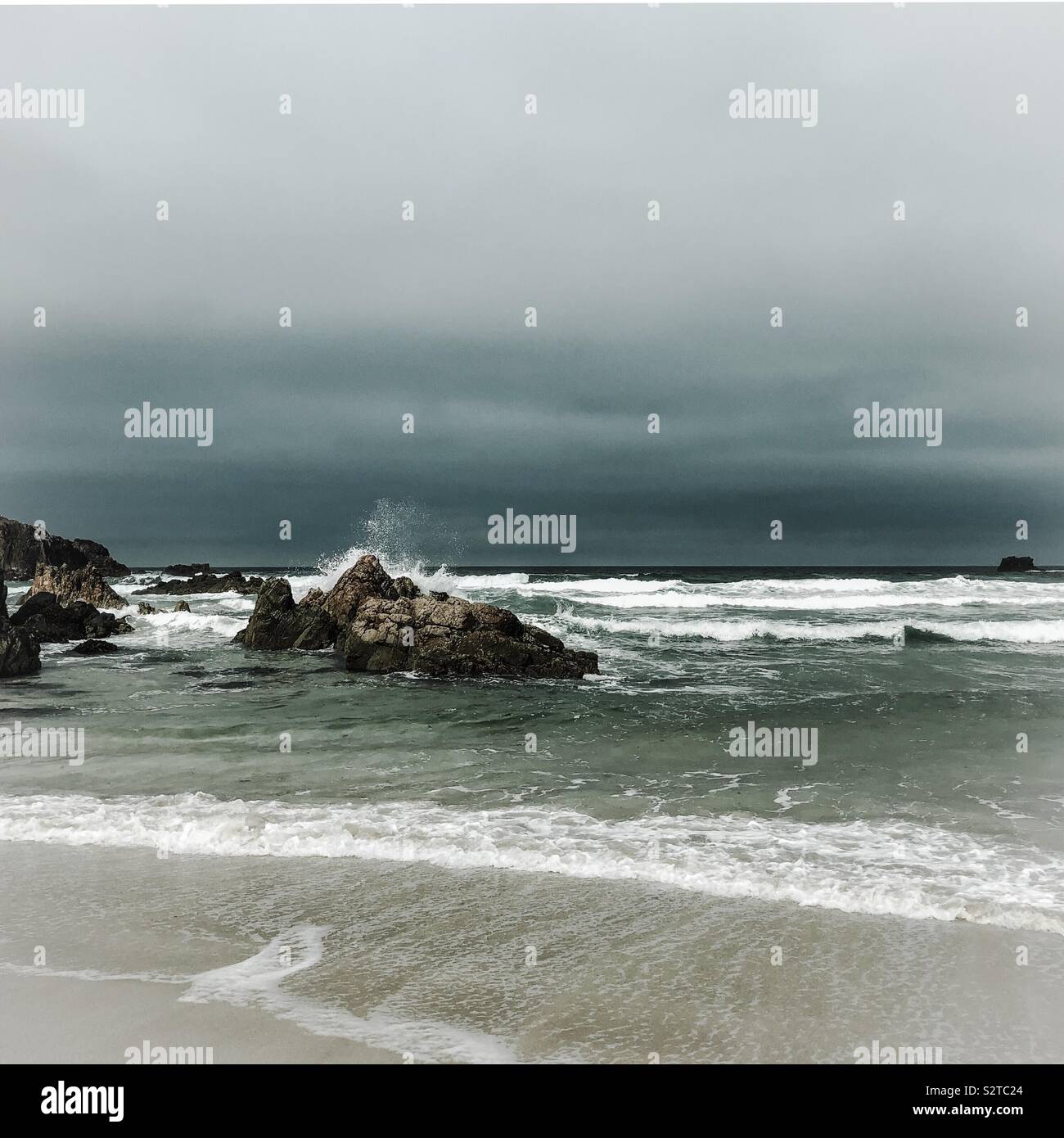 Wave breaking over a rock. Mangersta beach. Uig, Lewis, Outer Hebrides, Scotland. UK. - Smartphone Captured Stock Image