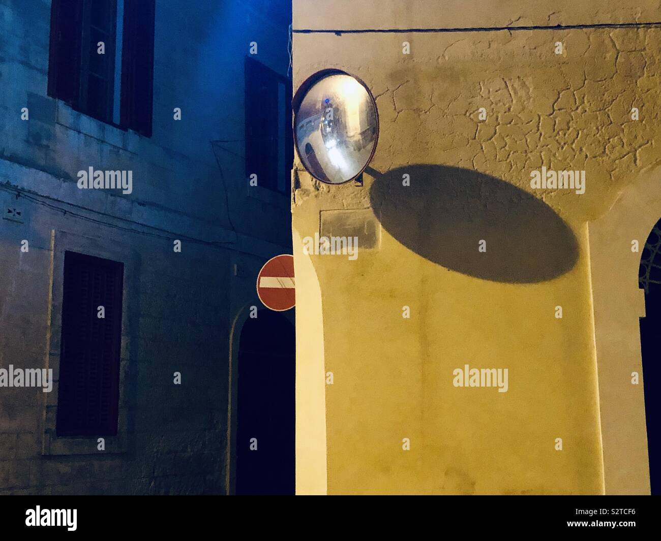 Mirror on a street corner in Malta at night Stock Photo Alamy